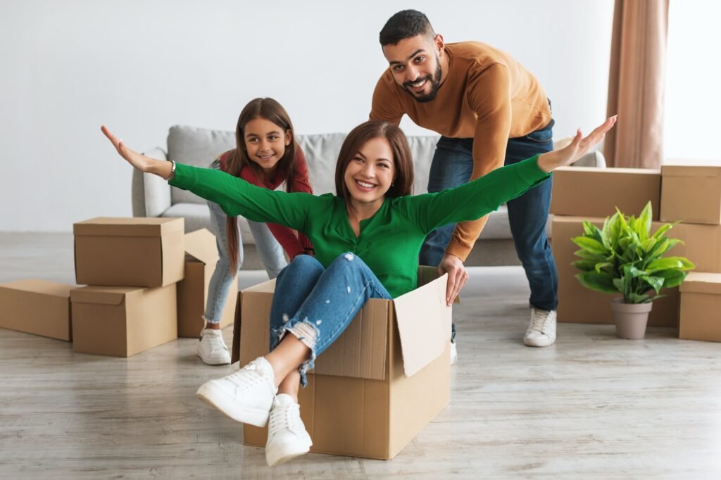 Happy family celebrating moving day in new apartment, Art and Creativity Wellness