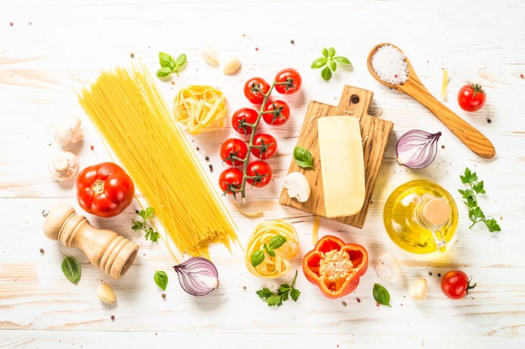 Italian food background at white bkitchen table