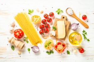 Italian food background at white bkitchen table