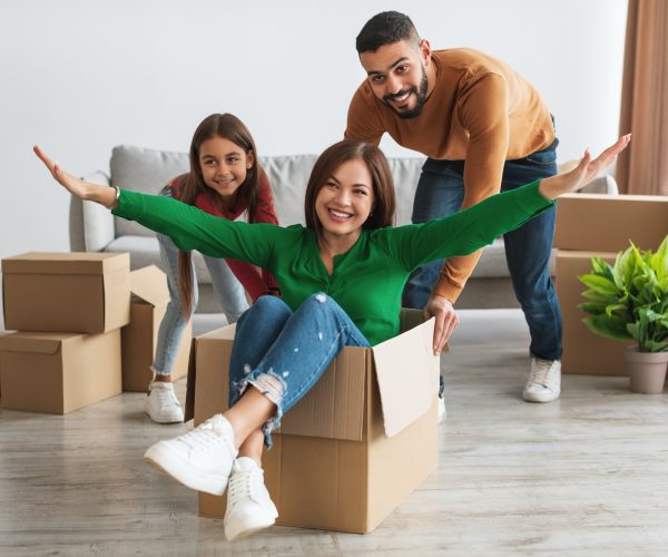 Happy family celebrating moving day in new apartment, Art and Creativity Wellness