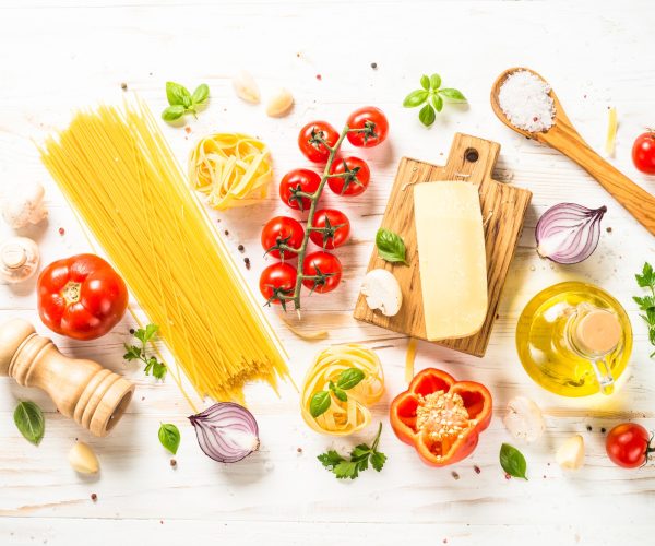Italian food background at white bkitchen table